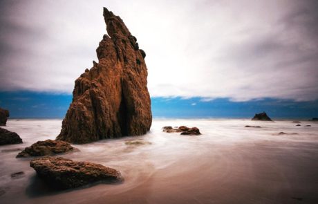 Vertical Rock Formation on Beach