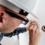 Electrician Repairing Wall Socket