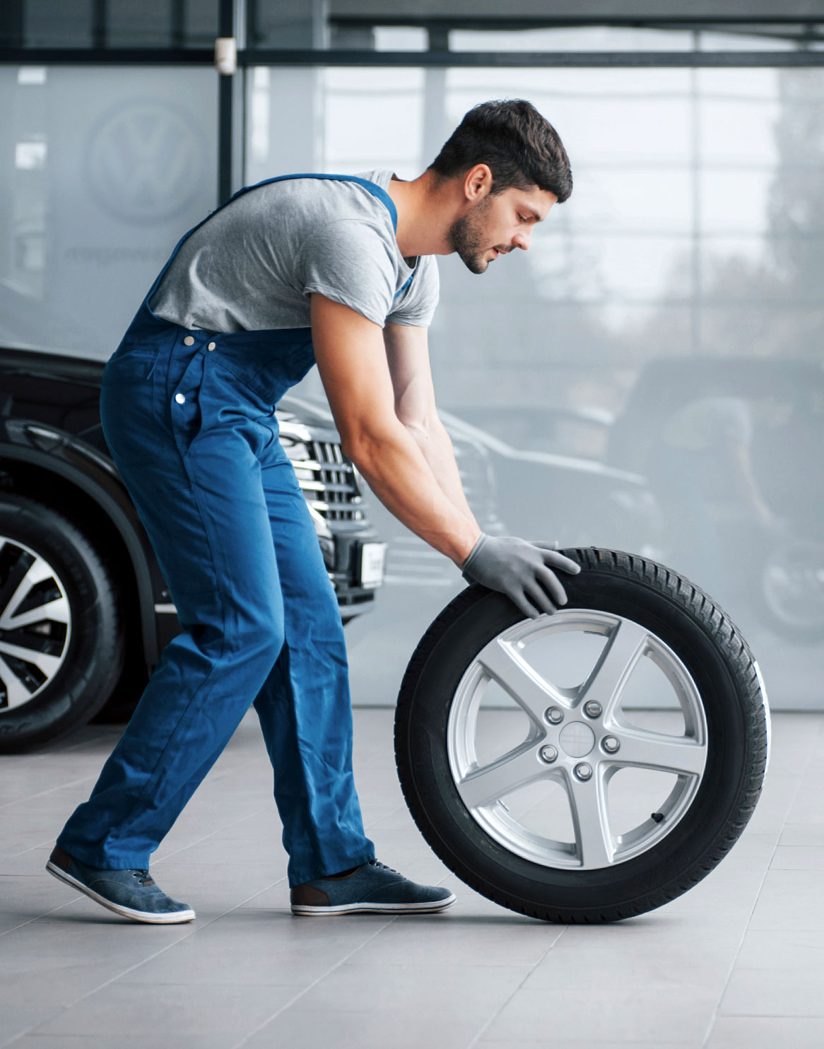 Man Moving Tire 1