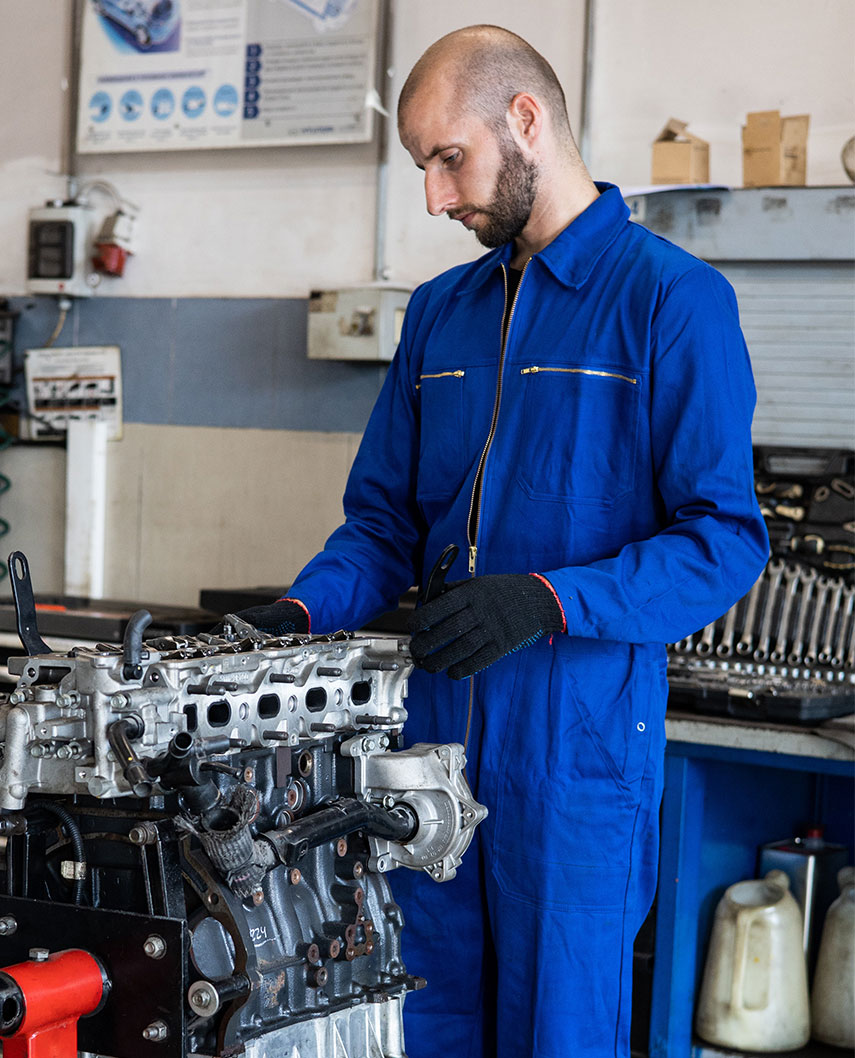 Mechanic Working on Engine Mechanic Working on Engine