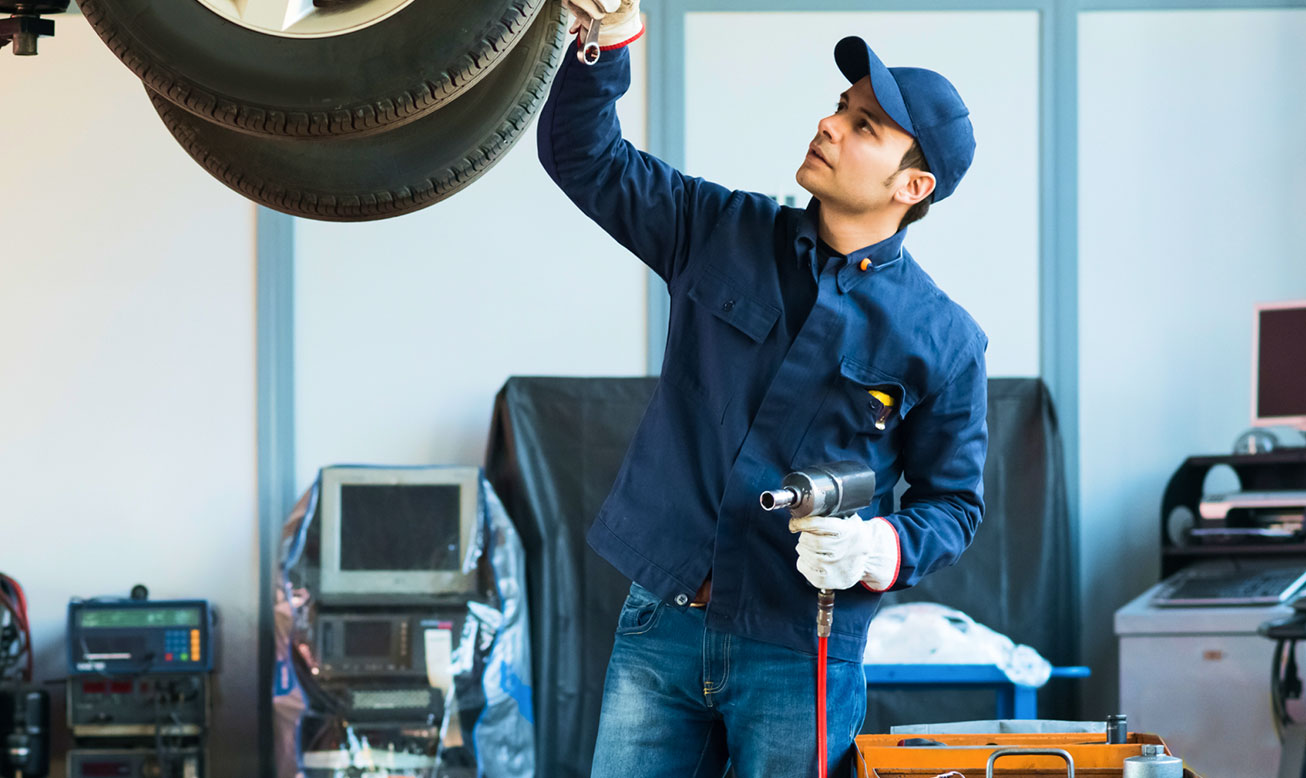 Mechanic Working on Car