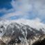 Snow & Tree Lined Mountains